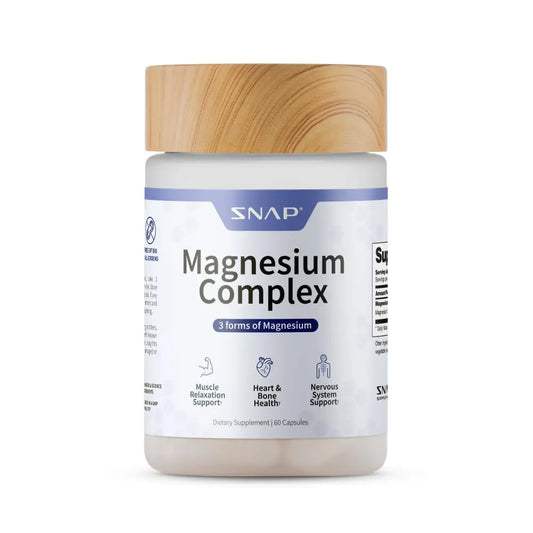 Supplement jar labeled 'Magnesium Complex' with a wooden cap on a white background